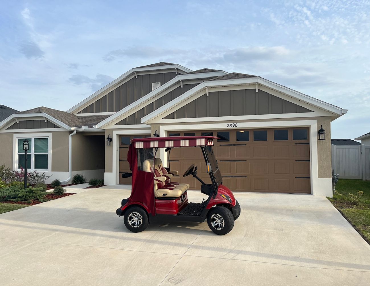 The home's cart parked in the driveway at dusk
